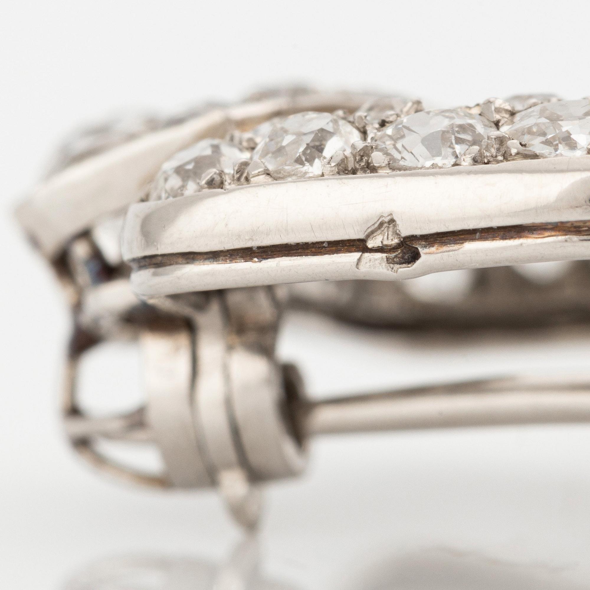 A Cartier platinum brooch set with old-cut diamonds, Art Déco.