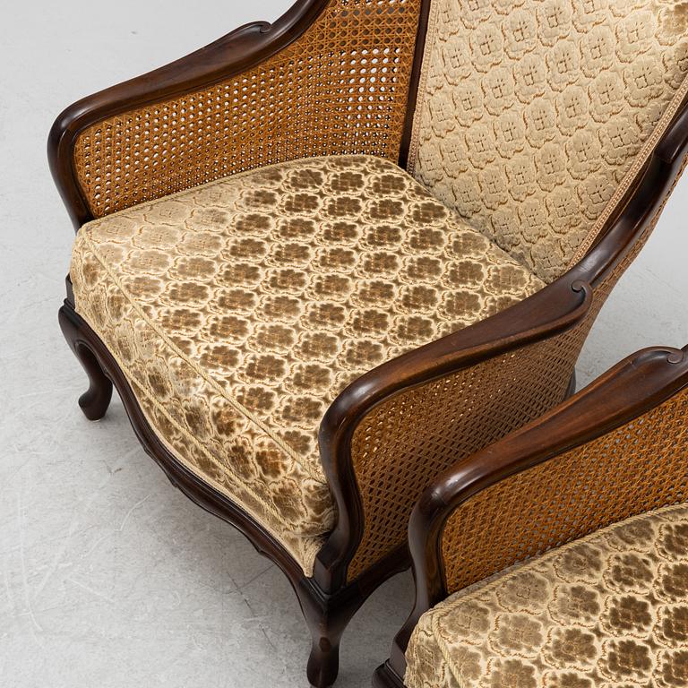 A pair of rococo style armchairs, first half of the 20th century.