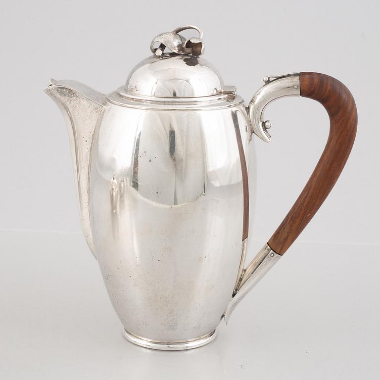 A Swedish Sterling Silver Coffee Pot, Creamer and Sugar Bowl, mark of Nordisk Silverkonst, Helsingborg 1948.