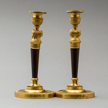 A pair of French Empire early 19th century candlesticks.