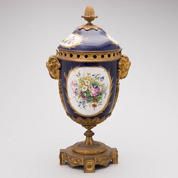 A FRENCH SÈVRES STYLE URN, porcelain and gilt bronze, latter half of the 19th century.