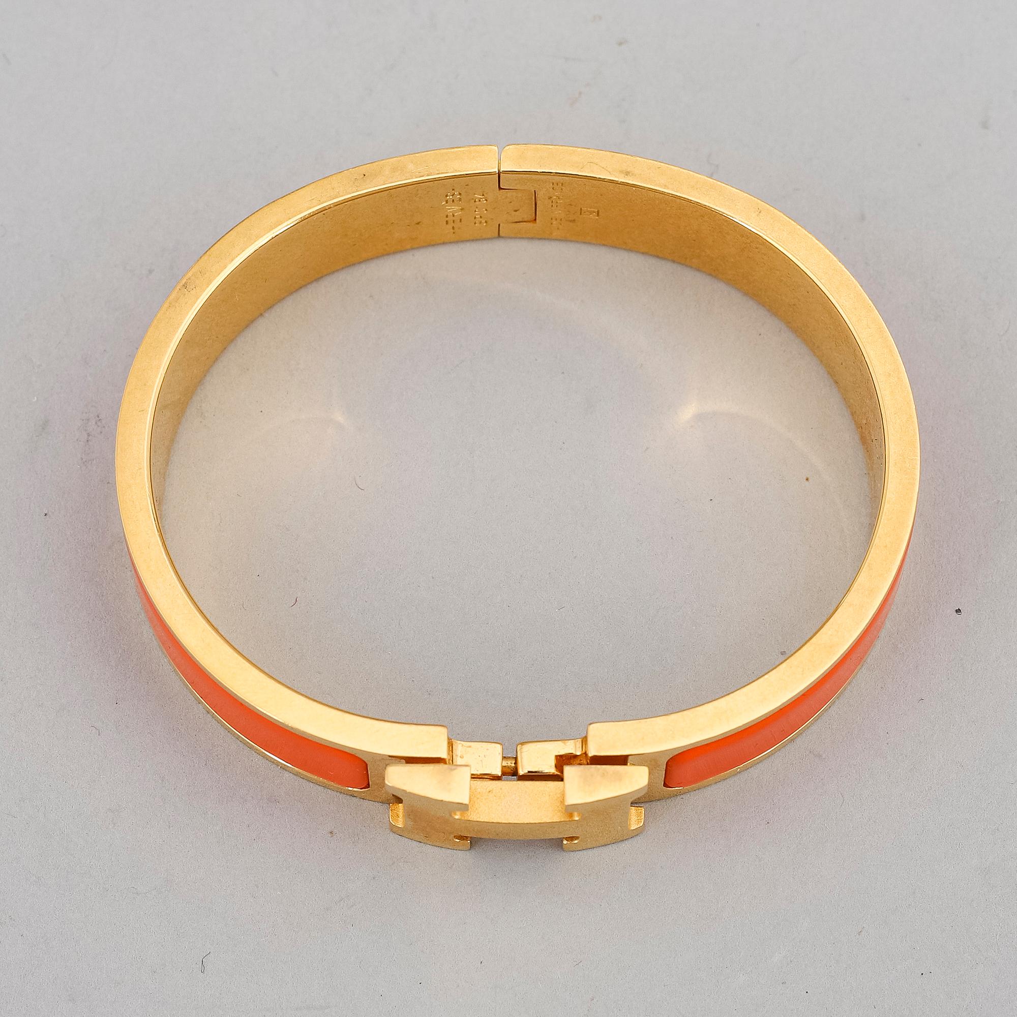 HERMÈS, a 'Clic H' bangle.