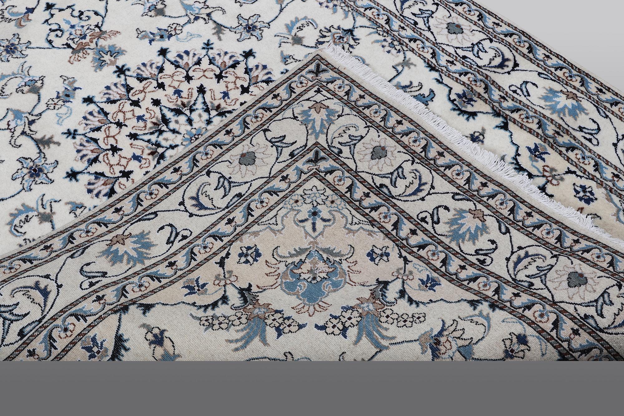 A rug, Nain, part silk, 238 x 163 cm.