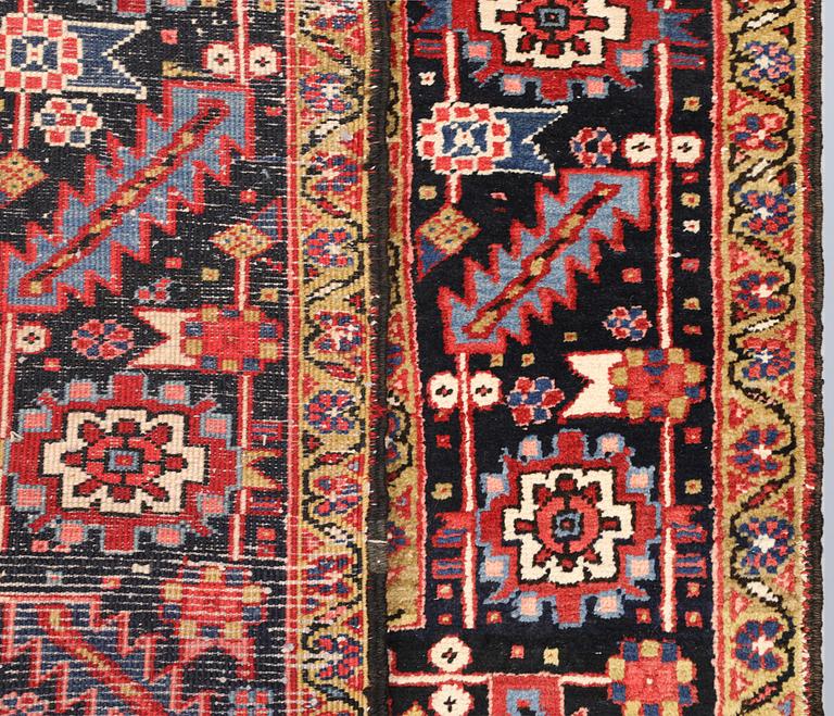 A semi-antique Heris carpet, approx. 343 x 260 cm.
