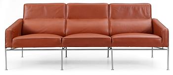 63. An Arne Jacobsen three-seated brown leather and chromed steel sofa by Fritz Hansen, Denmark.