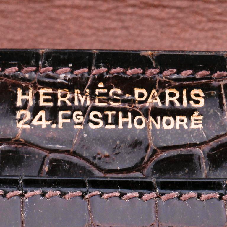 HERMÈS, a brown crocodile shoulder bag.