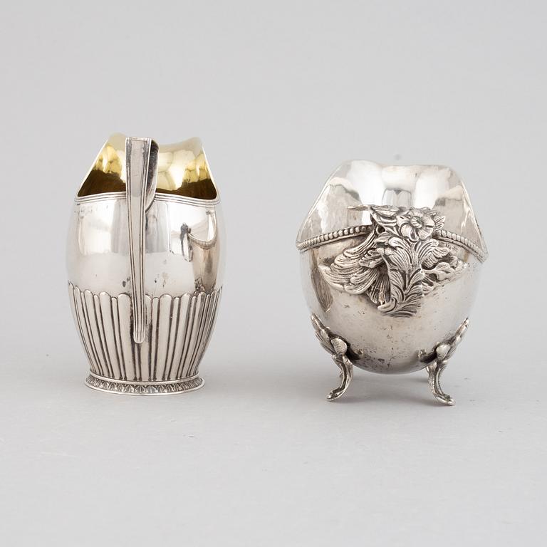 Two creamers, silver, one german and one Johan Petter Grönvall, Stockholm 1827.