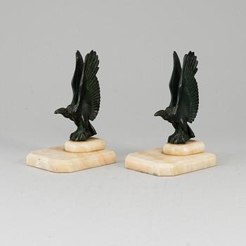 A pair of art déco marble and bronze book ends, 1930s.