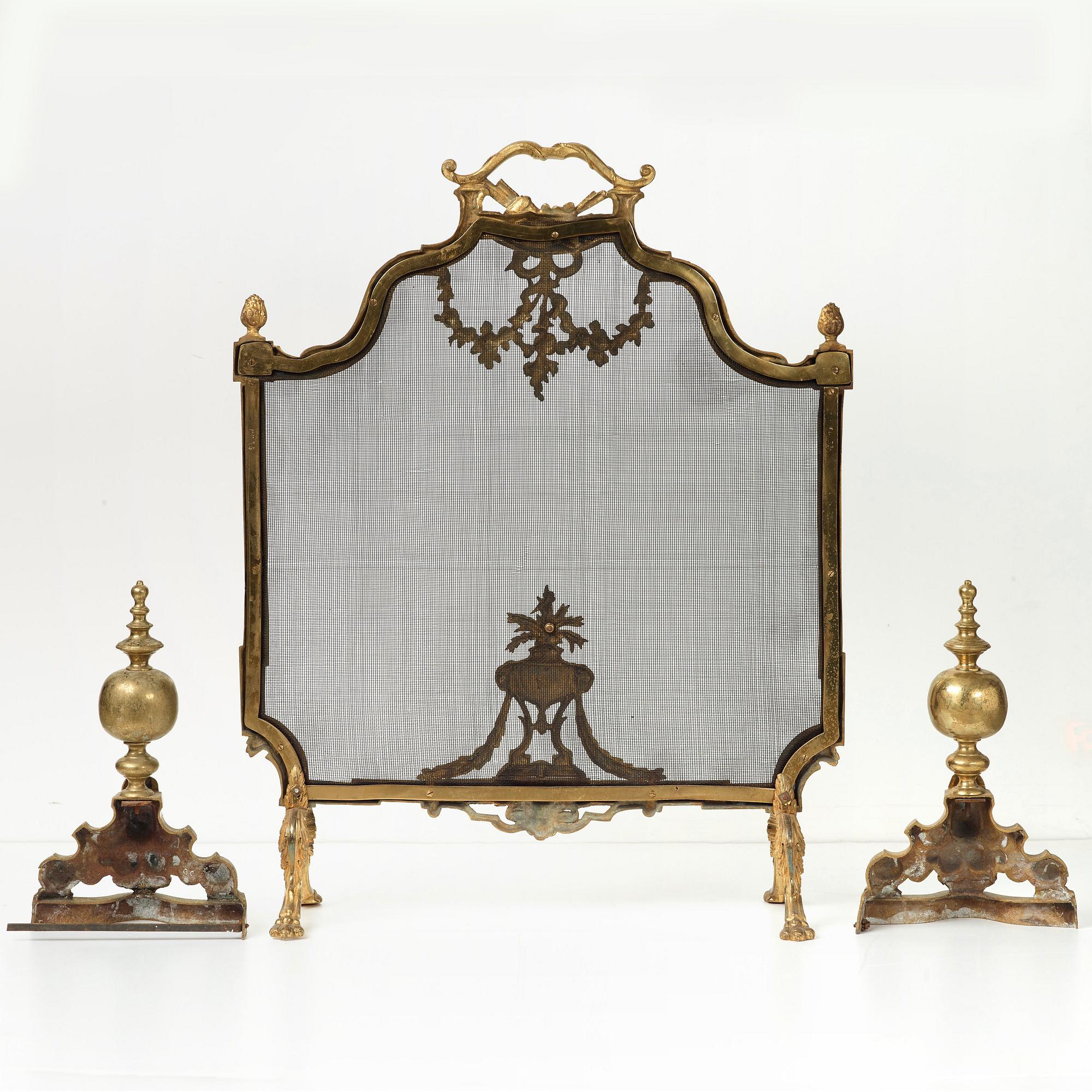One fire screen and a pair of fire dogs, first half of the 20th century.