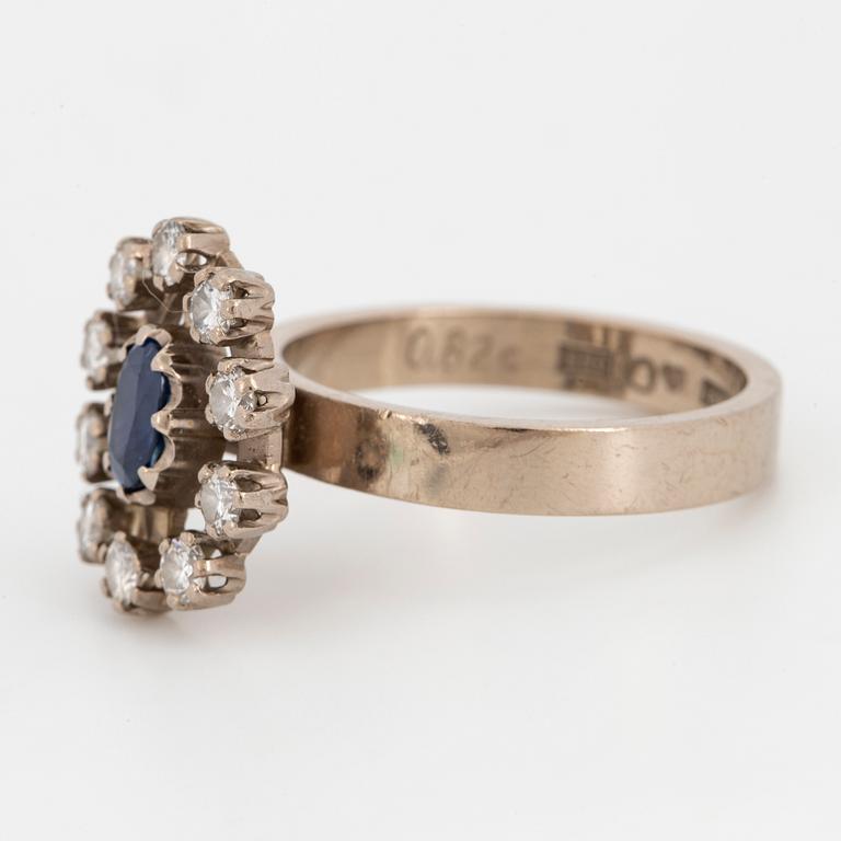 Oval faceted sapphire and brilliant-cut diamond ring.