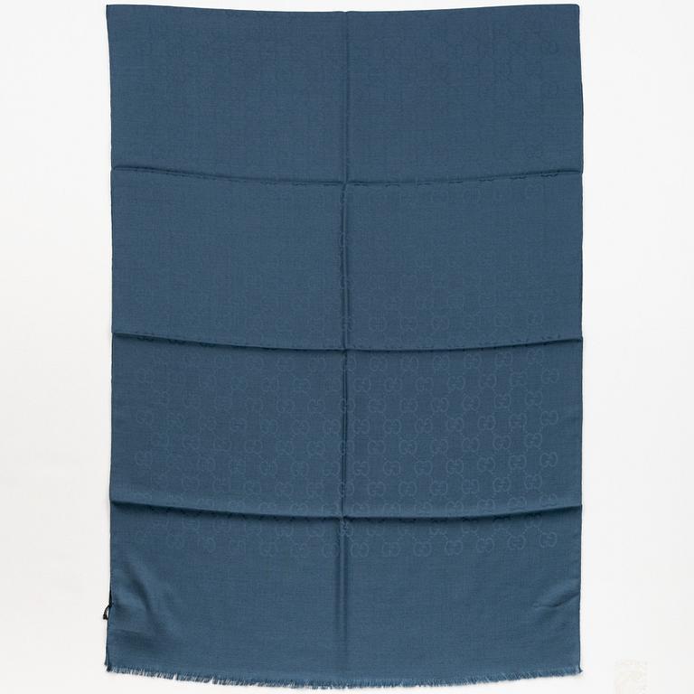 Gucci, a wool and silk mix "GG" jaquard shawl.