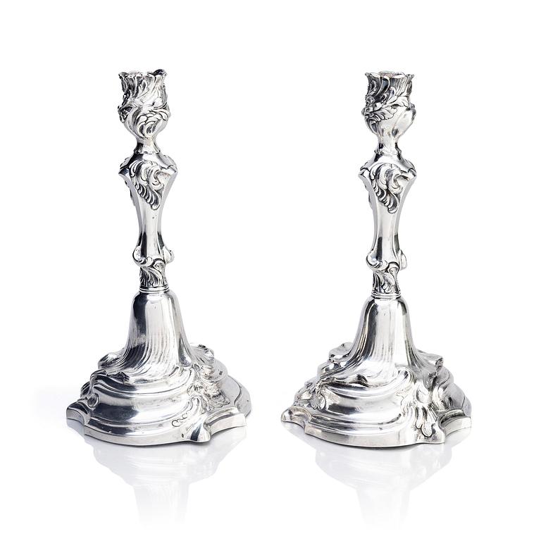 A pair of Swedish Rococo silver candlesticks, marks of Abraham Lundberg, Stockholm 1765.