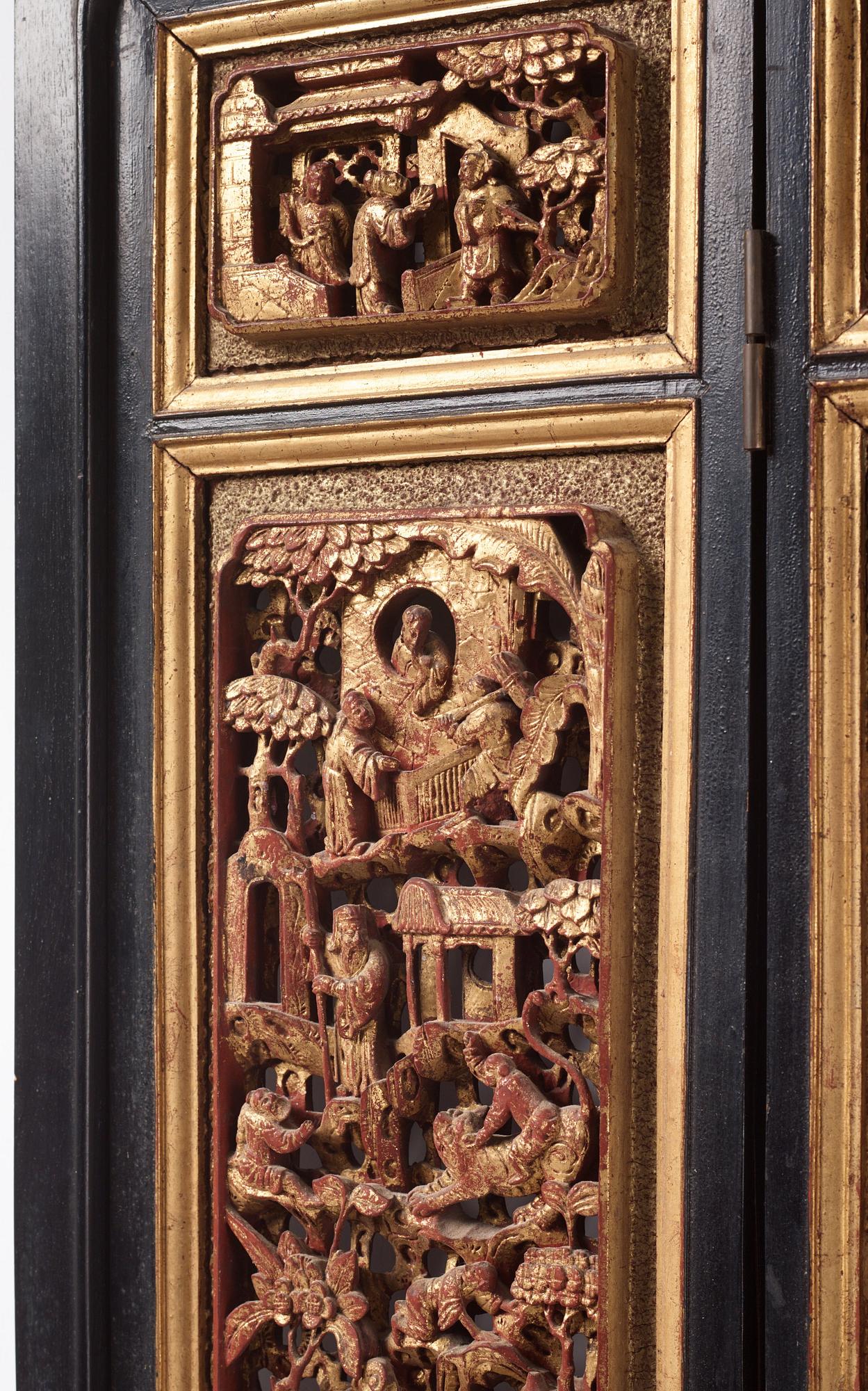 A set of four framed wooden panels, Qing dynasty, 19th Century.
