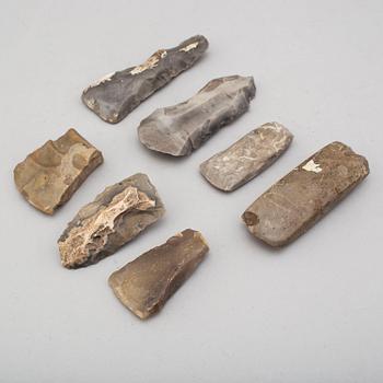 Seven small flint axes.