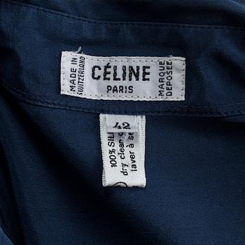 A navyblue silk blouse by Cèline.