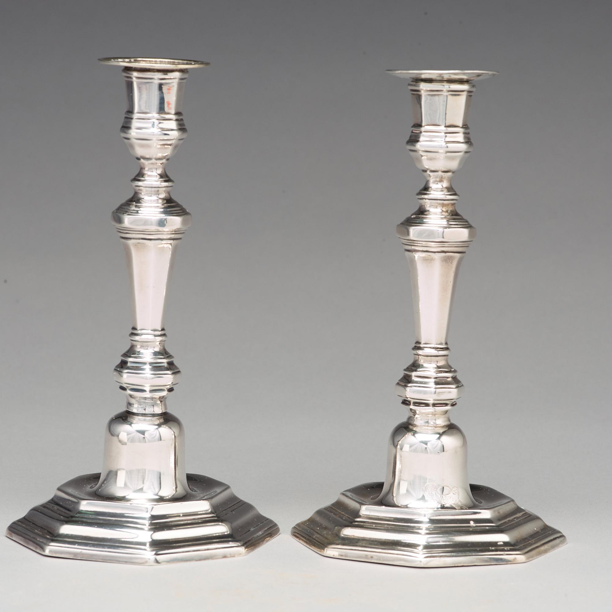 A pair of European 18th century silver candlesticks, unidentified makers mark.