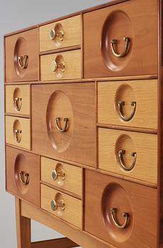 A Josef Frank cabinet on stand with thirteen different size  drawers,