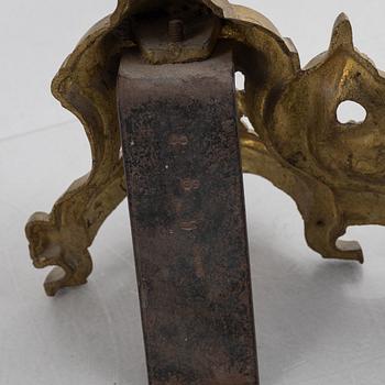 A pair of Louis XVI-style bronze andirons, France, later part of the 19th century.