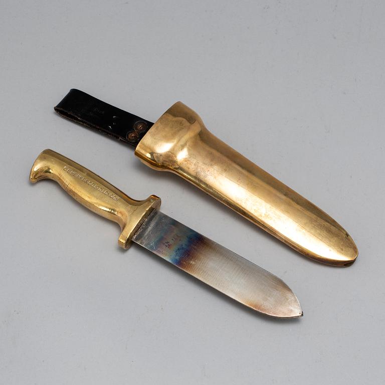 A brass diver's knife from C.E. Heinke & Co. Ltd., London, England.