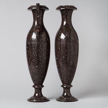 A pair of Swedish late Empire 19th century porphyry urns.