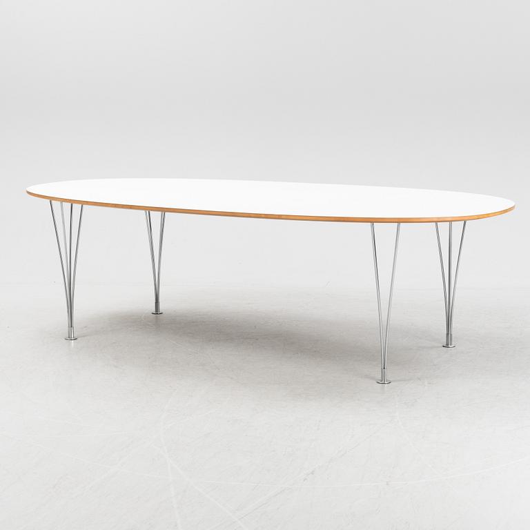 A Super ellpitical dining table, by Bruno Mathsson and Piet Hein for Fritz Hansen dated 2008.