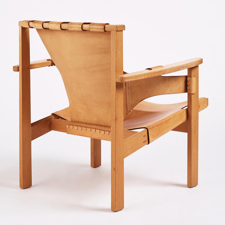 Carl-Axel Acking, a Swedish Modern oak and natural brown leather 'Trienna' chair, Nordiska Kompaniet.