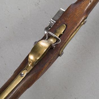 A flintlock rifle from Tower, England, around the year 1800.