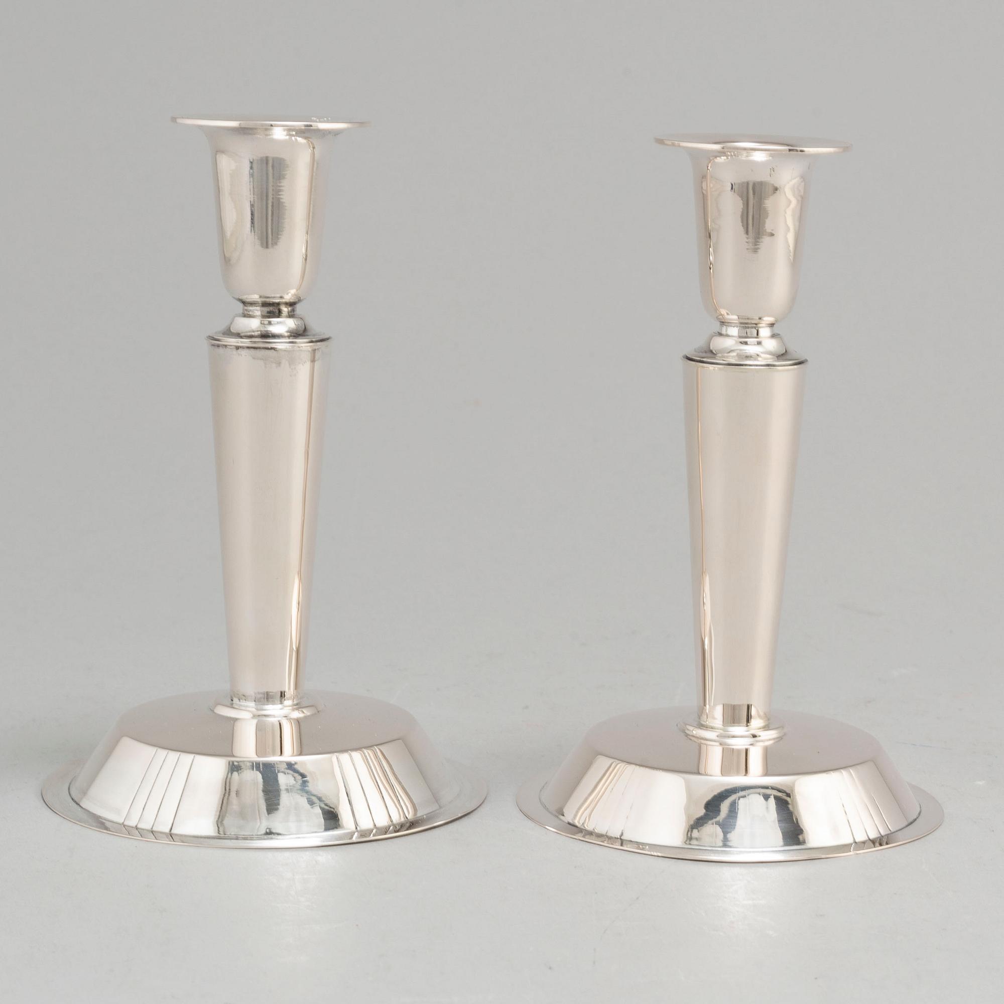 ERIC RÅSTRÖM, a pair of silver candlesticks, Stockholm 1954.