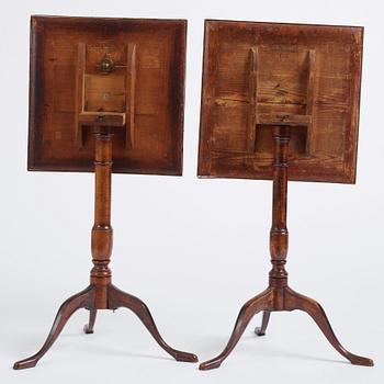 A pair of alder-veneered tilt-top tables by C. Hollst (master 1787-1830).