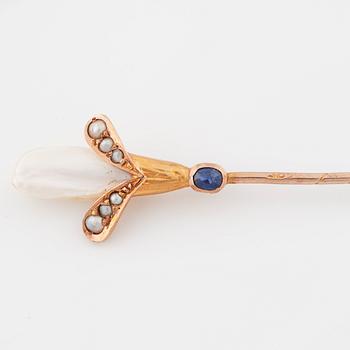 Two pins set with cultured pearls and a synthetic ruby and a synthetic sapphire.