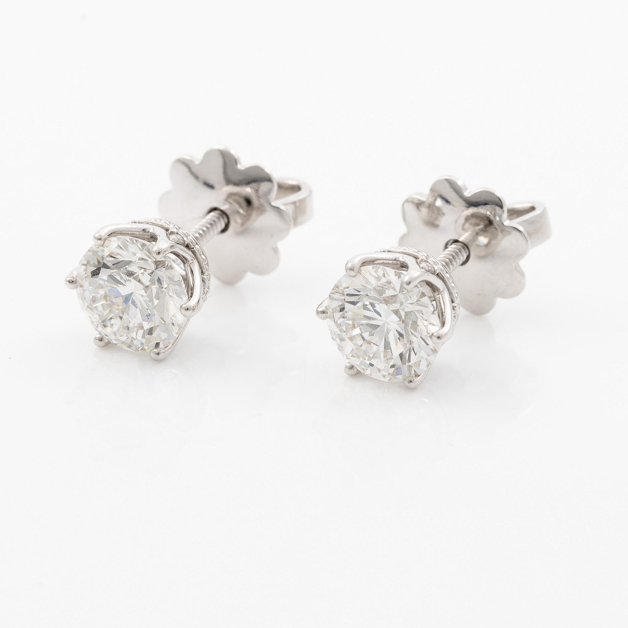 Earrings, single-stone earrings in 18K white gold with brilliant-cut diamonds, accompanied by IGI report.
