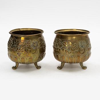 A pair of Baroque style brass plant pots, late 19th Century.