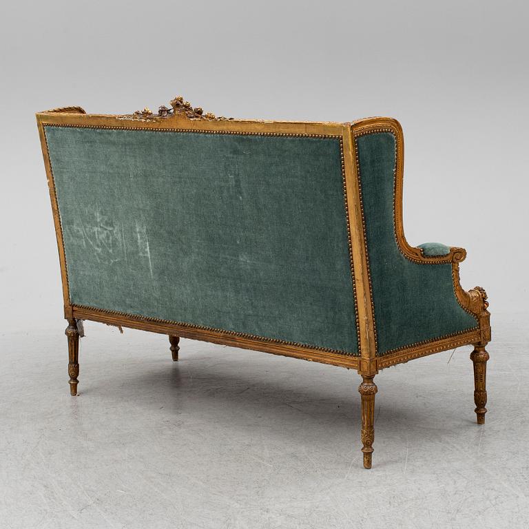 A Louis XVI-style sofa, ca 1900.