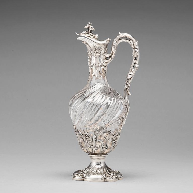 A French mid 19th century parcel-gilt silver and glass wine-jug.