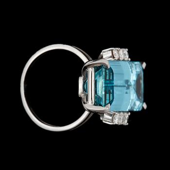 A aquamarine and diamond ring. Aquamarine circa 14.00 cts and total carat weight of diamonds circa 0.40 ct.