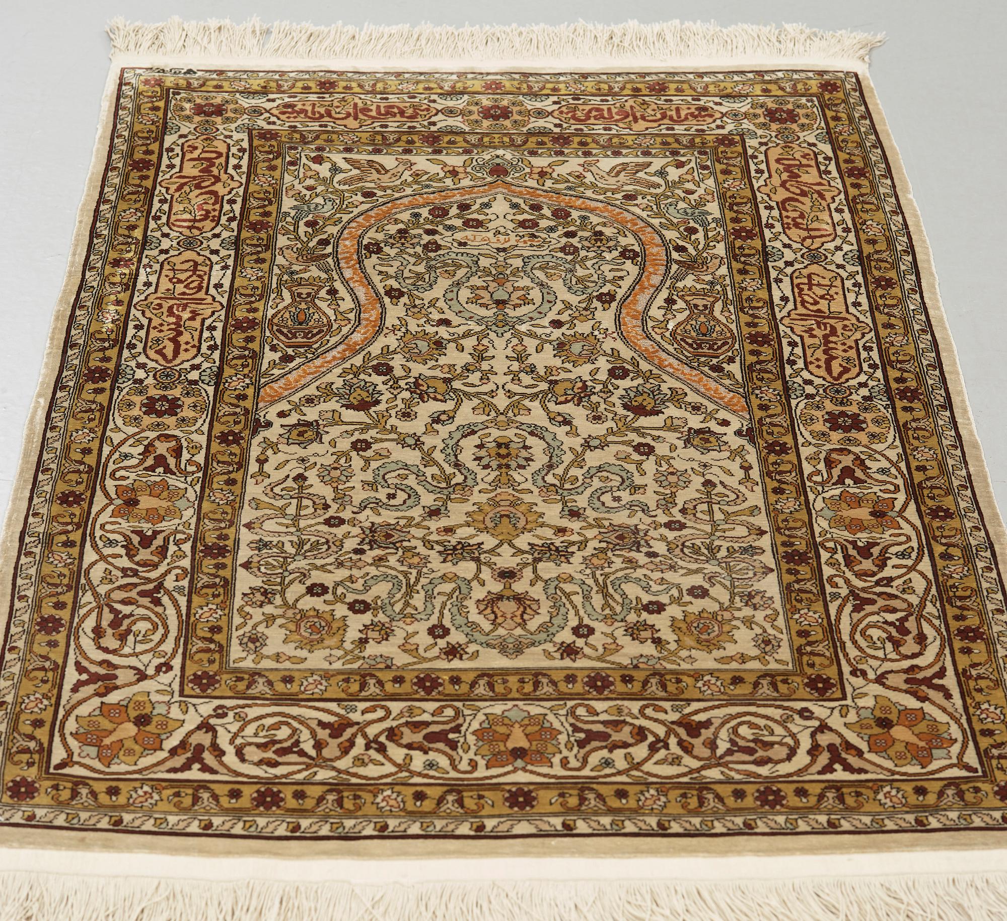 A silk Hereke possibly, around 96 x 66 cm.