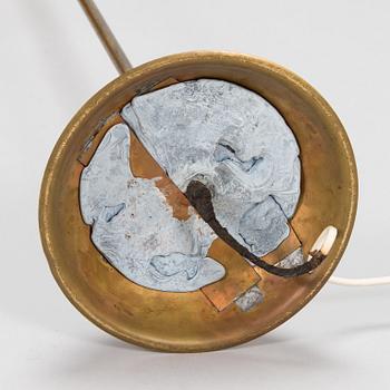 A 1950s floor lamp in brass.
