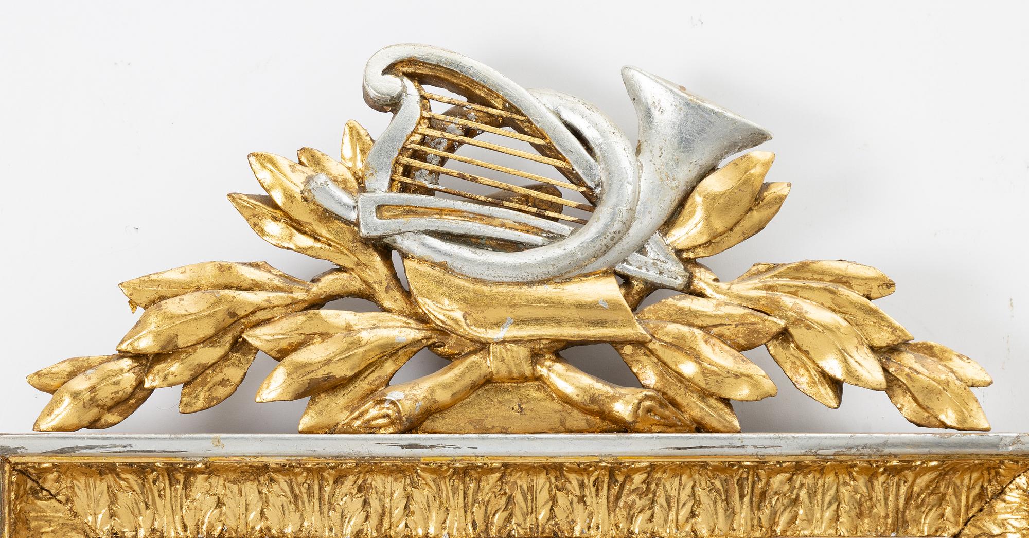 A gilt-gesso two-branch Empire girandole mirror, first part 19th century.