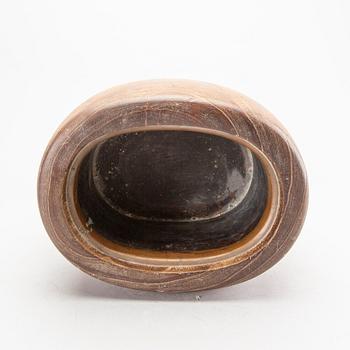 A set of four bronze giurines, a wooden bowl, two stands and one porcelain cup with stand, 20th century.