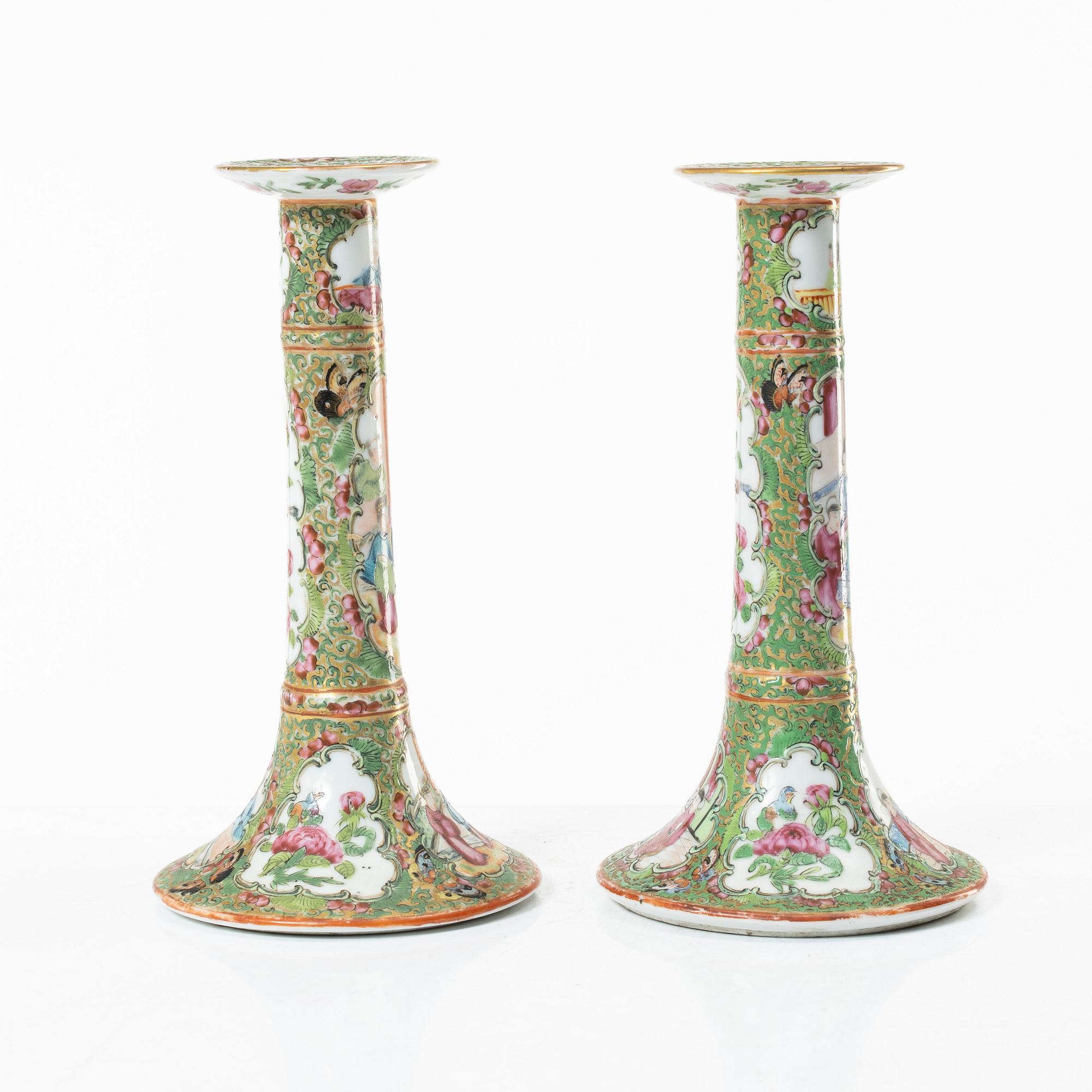 A pair of famille rose Canton candle sticks, Qing dynasty, 19th century.