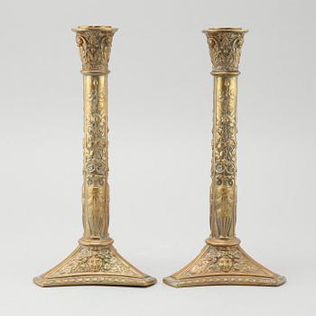 A pair of brass candlesticks from Elkingtons in Birmingham, 19th century.