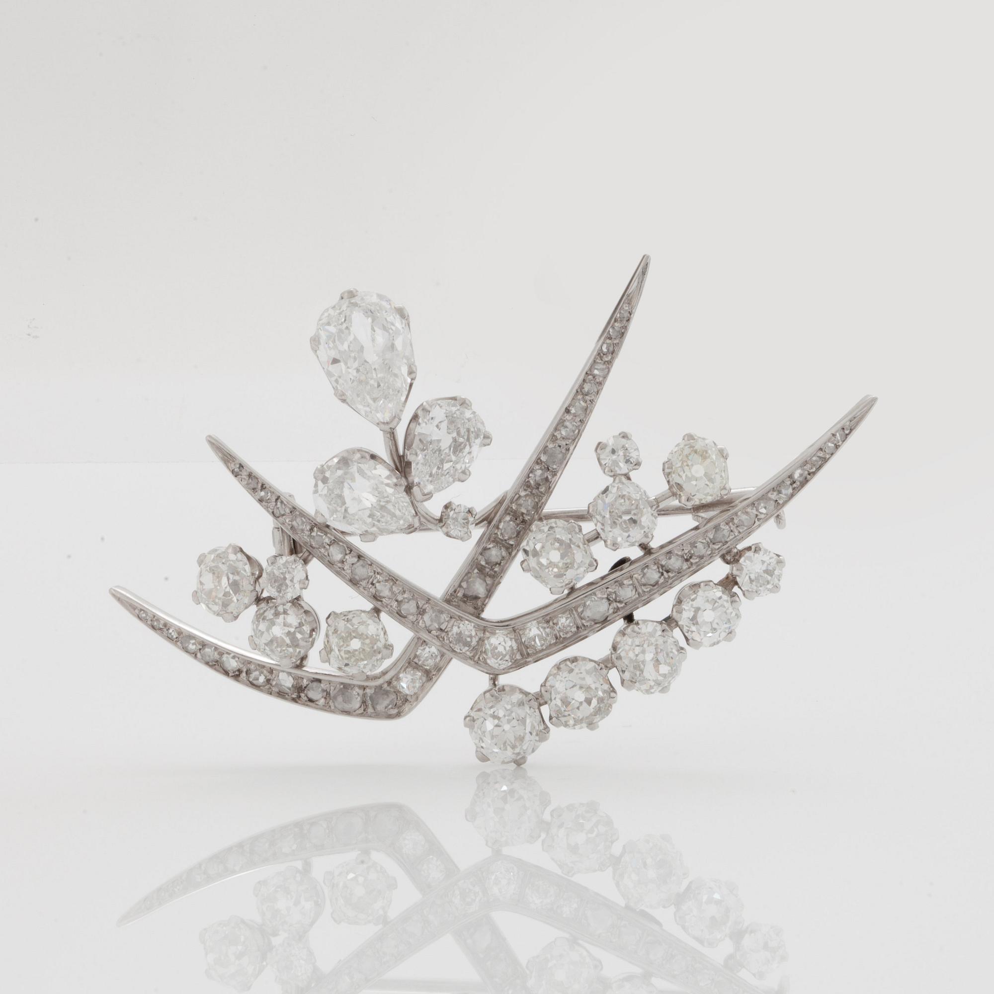 A TIARA with cultured pearls and a detachable brooch set with old-cut diamonds.