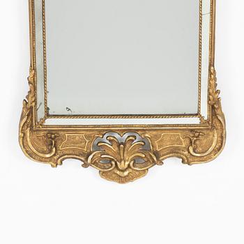 A giltwood rococo mirror, later part of the 18th century.