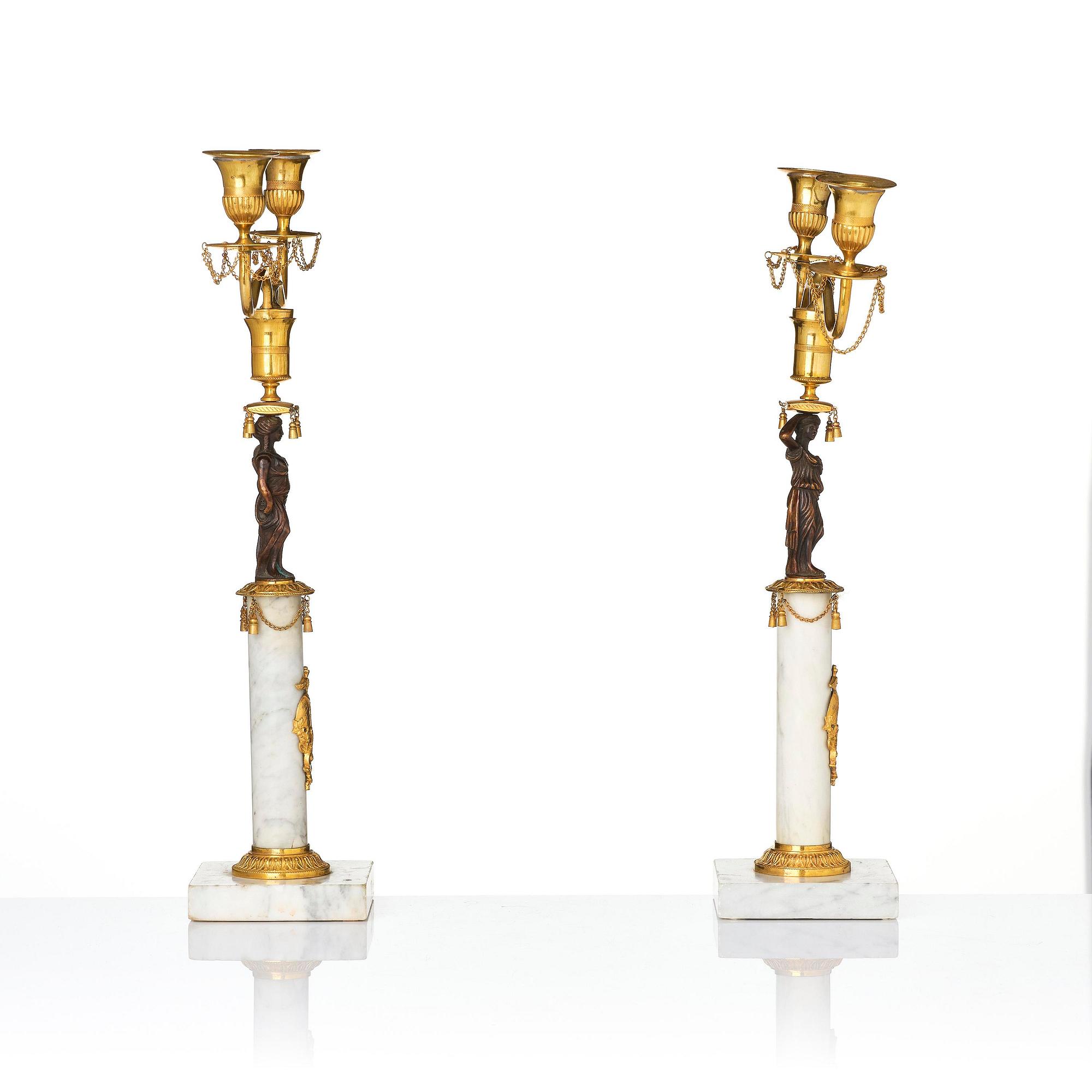 A pair of late Gustavian two-branch candelabra in the manner of F. L. Rung, Stockholm, circa 1800.