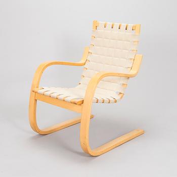 Alvar Aalto, a 1980s Artek 406 armchair.