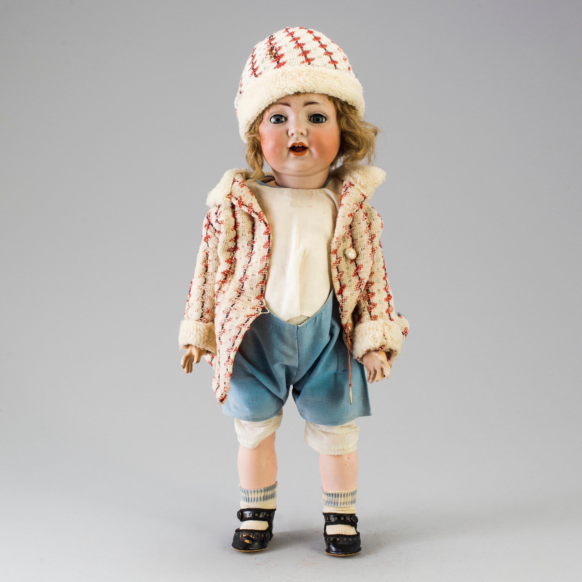 A bisque headed doll, Germany, early 20th century.