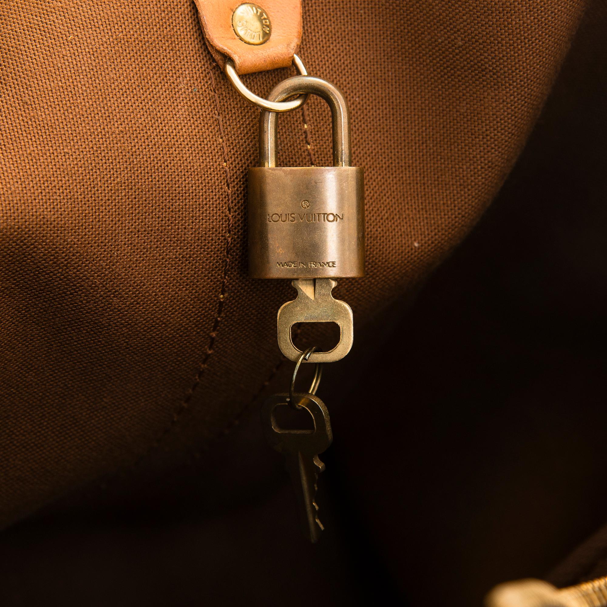 Louis Vuitton, a Monogram Canvas 'Keepall 55 Bandoulière' weekend bag.