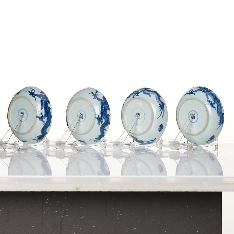 A set of four blue and white dragon dishes, Qing dynasty, 18th Century.