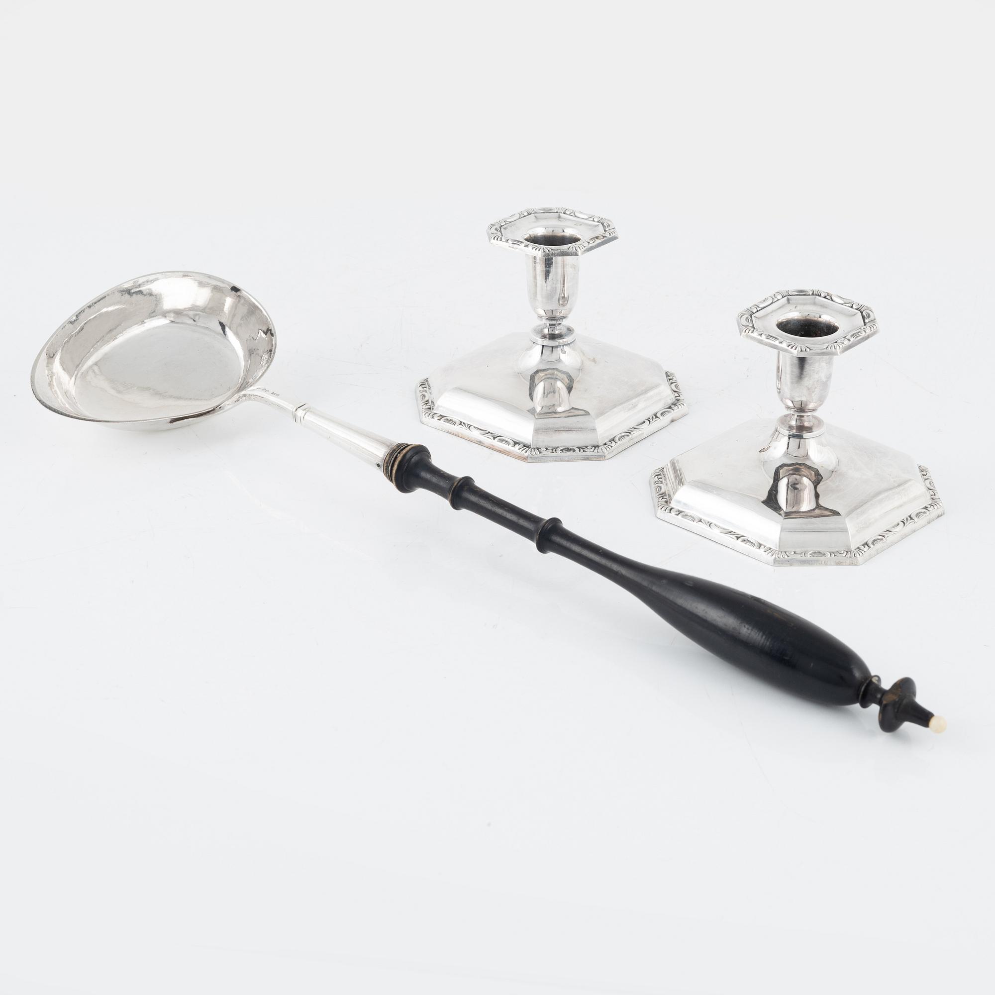 A Swedish Silver Ladle, mark of Adolf Öström, Piteå 1887 and a pair of Silver Candlesticks.