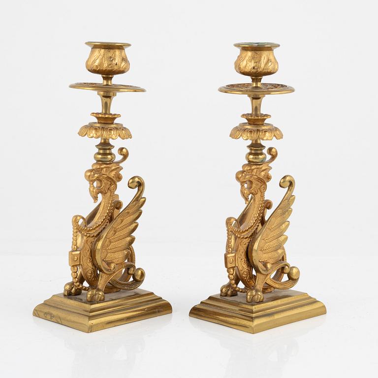 A pair of brass candleholders, 20th century.